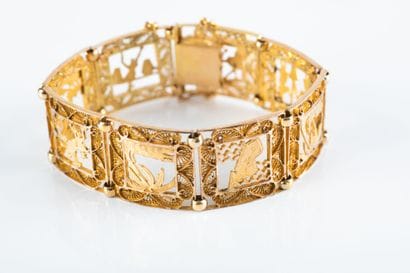 Yellow gold bracelet decorated with openwork...