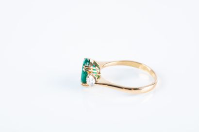 Yellow gold ring set with an oval emerald...