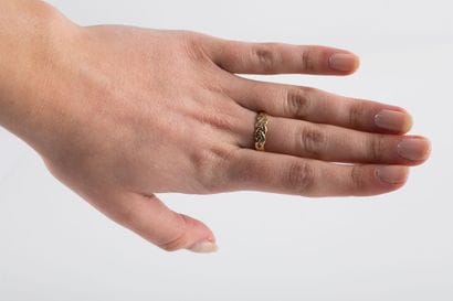 Yellow gold half wedding band with braided...