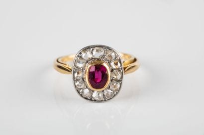 Gold and platinum ring set with a synthetic...