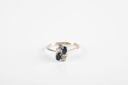 Gold ring set with oval sapphires and brilliant-cut...