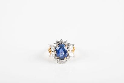 Gold ring set with a sapphire weighing approximately...