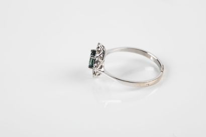 White gold ring set with an oval sapphire...