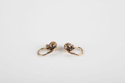 Pair of yellow gold sleeper earrings set...