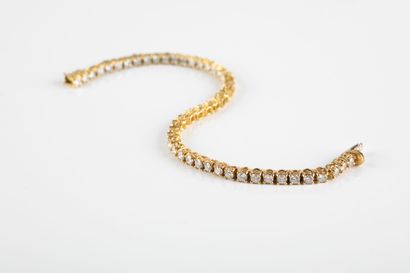 Gold river bracelet, set with brilliant cut...