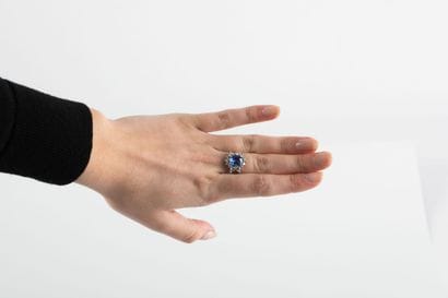 Gold ring set with a sapphire weighing approximately...