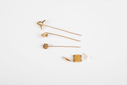 Gold lot including three pins, a clasp ratchet...