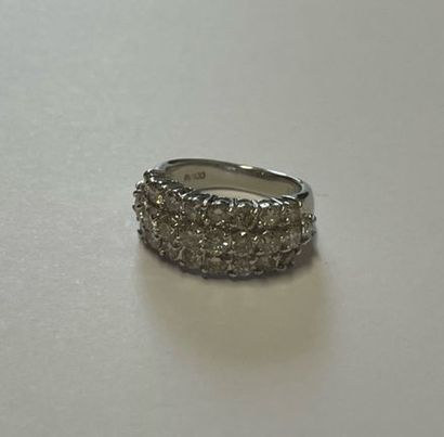 Platinum ring decorated with a pavement of...