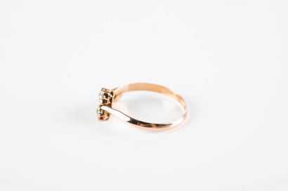 Pink gold ring featuring three stars set...