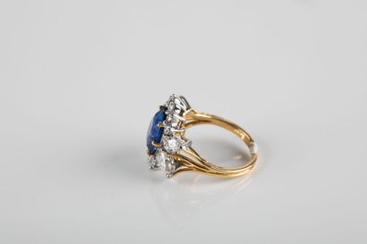 Gold ring set with a sapphire weighing approximately...