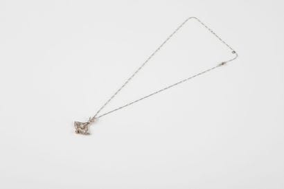 Figaro chain in platinum holding a yellow...