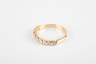 Gold half wedding band set with nine brilliant-cut...