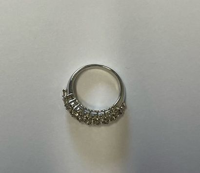Platinum ring decorated with a pavement of...