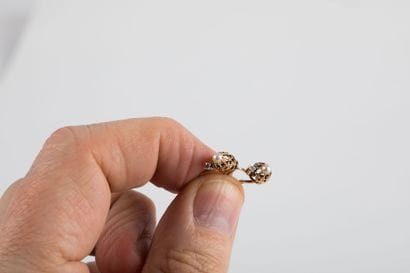 Pair of yellow gold sleeper earrings set...