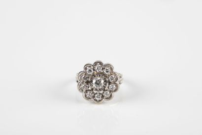 Gold and platinum daisy ring set with a diamond...
