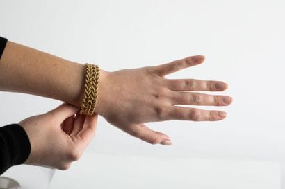 Yellow gold bracelet decorated with chevrons...