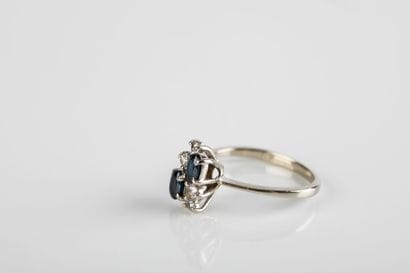 Gold ring set with oval sapphires and brilliant-cut...