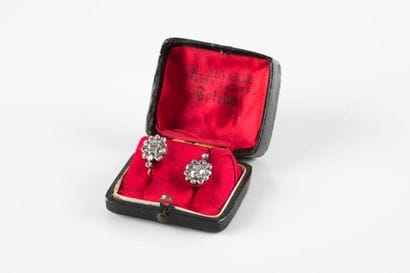 Pair of gold and silver earrings set with...