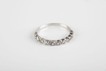 Half wedding band set with eleven brilliant-cut...