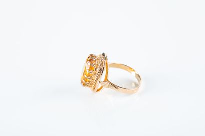 Yellow gold ring set with a yellow sapphire....