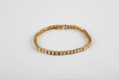 Gold river bracelet, set with brilliant cut...