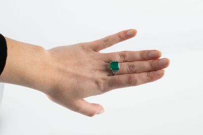 White gold ring set with a large emerald...
