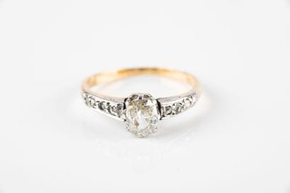 Solitaire ring set with a cushion-cut diamond...