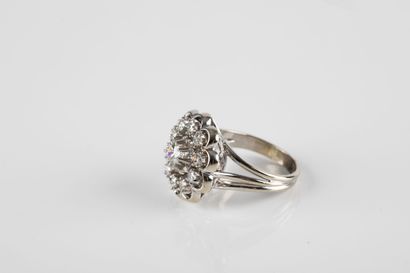 Gold and platinum daisy ring set with a diamond...