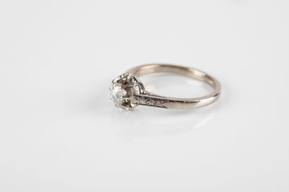 Gold and platinum solitaire ring set with...