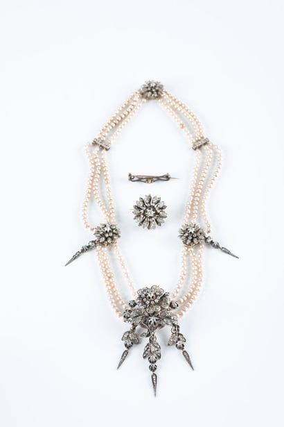 Gold and silver necklace composed of three...