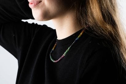 Necklace adorned with a declination of colored...