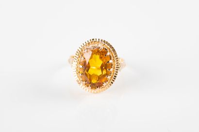 Yellow gold ring set with a yellow sapphire....