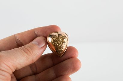 Gold casting representing a heart with floral...