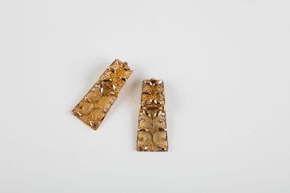 Pair of clip-on earrings with filigree plates....