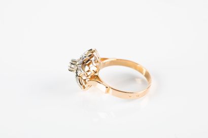 Gold ring featuring a half-sphere decorated...