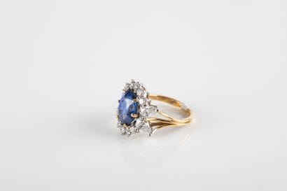 Gold ring set with a sapphire weighing approximately...