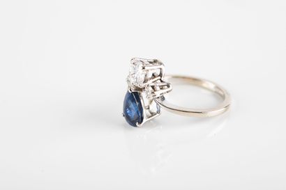 White gold ring set with a pear-cut sapphire...