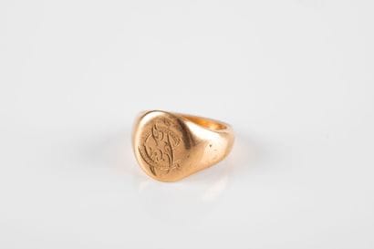Gold signet ring engraved with a monogram...