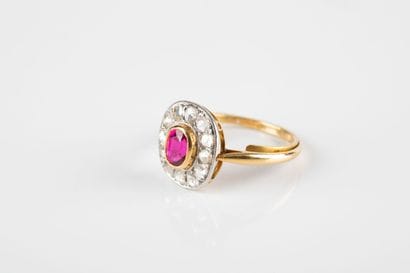 Gold and platinum ring set with a synthetic...