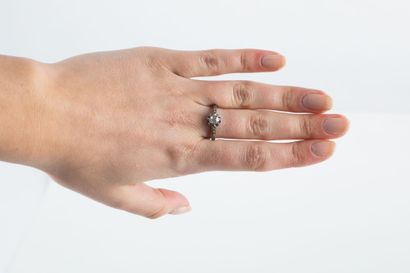 Gold and platinum solitaire ring set with...