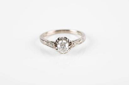 Gold and platinum solitaire ring set with...