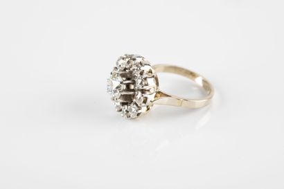 Gold and platinum ring holding one old-cut...