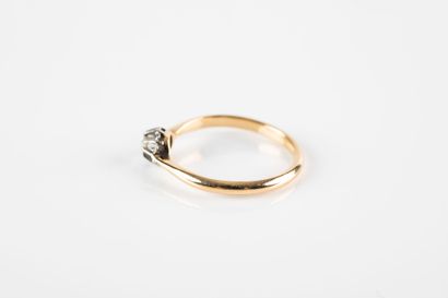 Gold and platinum solitaire ring set with...