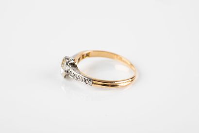 Solitaire ring set with a cushion-cut diamond...