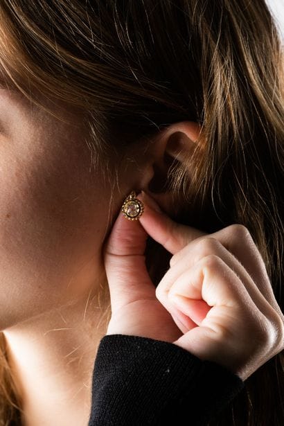 Pair of yellow gold sleeper earrings, centered...