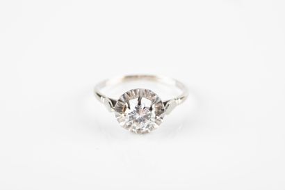 Gold and platinum solitaire ring set with...