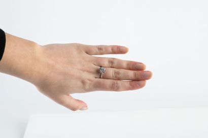 White gold solitaire ring holding a brilliant-cut...