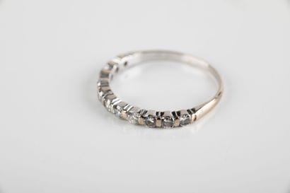 Half wedding band set with eleven brilliant-cut...