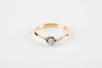 Gold and platinum solitaire ring set with...