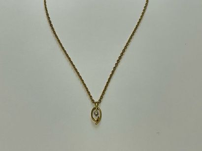 Gold long necklace, with a pendant centered...